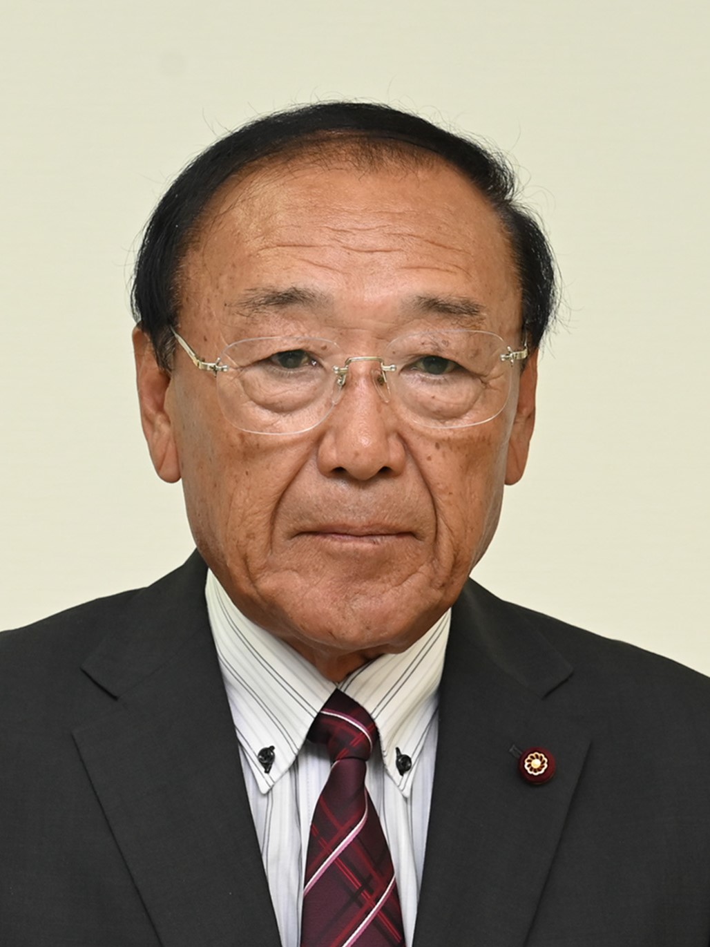本間 輝男