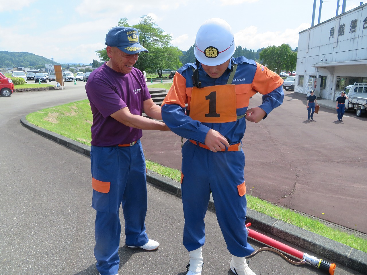出場した研修生とその父
